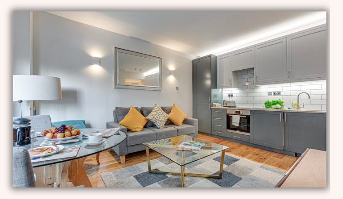 Cosy living area with gallery wall in Nell Gwynn House apartment 440